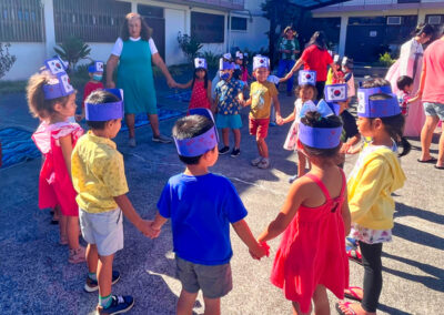 Makiki Christian Church Preschool Korean Culture Day students form a circle and holding hands, Honolulu